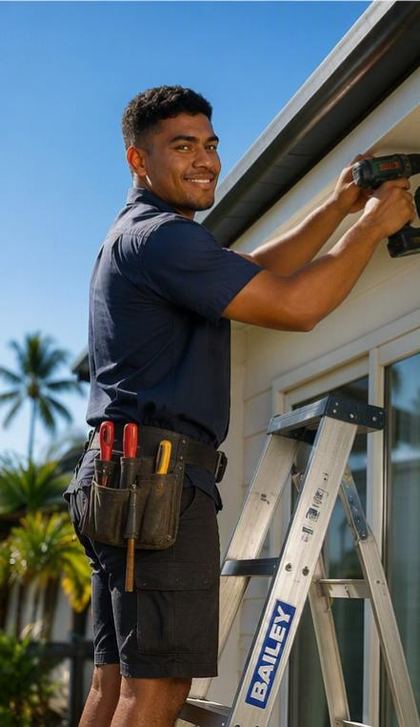 Two tradies unloading a ladder from a ute in Fiji